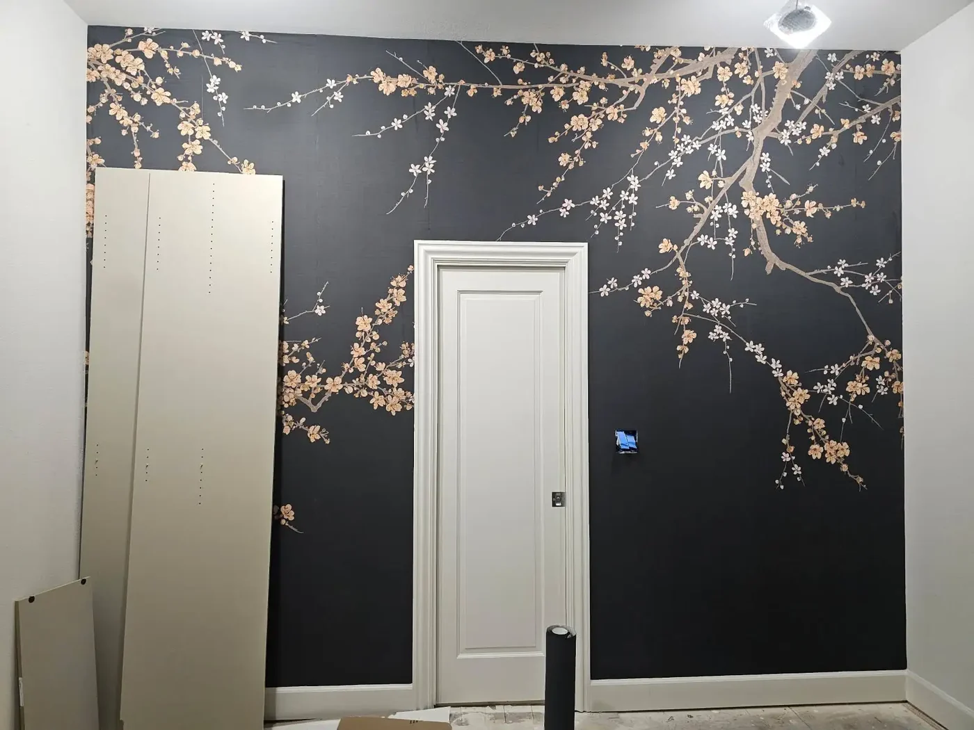 Floral wallpaper creating a dark, expressive accent wall